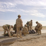 Canadian troops evacuate wounded soldiers after their vehicle was hit by an oncoming vehicle near Kandahar City. Photo: Corporal Robin Mugridge